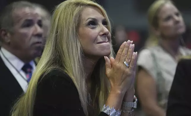 Lisa Matassa of Nashville watches results during a watch party for Republican Presidential nominee former President Donald Trump at the Palm Beach County Convention Center during an election night watch party, Tuesday, Nov. 5, 2024, in West Palm Beach, Fla. (AP Photo/Lynne Sladky)