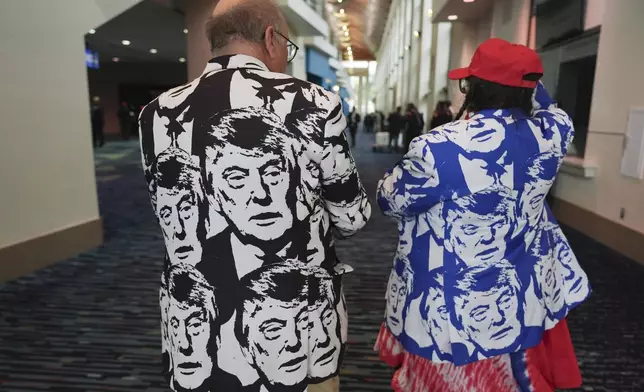 Steve and Jodie McGuire of Bettendorf, Iowa, arrive to attend a watch party for Republican Presidential nominee former President Donald Trump at the Palm Beach County Convention Center during an election night watch party, Tuesday night, Nov. 5, 2024, in West Palm Beach, Fla. (AP Photo/Lynne Sladky)