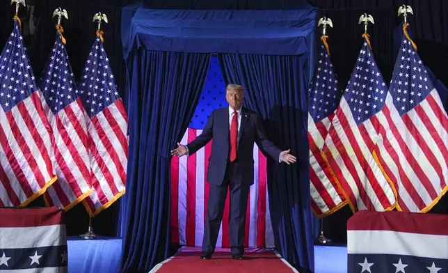 Republican presidential nominee former President Donald Trump arrives for a campaign rally at Van Andel Arena, Tuesday, Nov. 5, 2024, in Grand Rapids, Mich. (AP Photo/Evan Vucci)