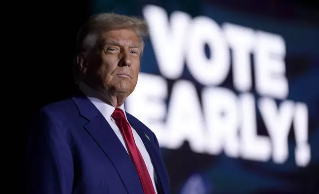 Republican presidential nominee former President Donald Trump arrives to speak during a campaign rally at the Suburban Collection Showplace, Saturday, Oct. 26, 2024, in Novi, Mich. (AP Photo/Alex Brandon)