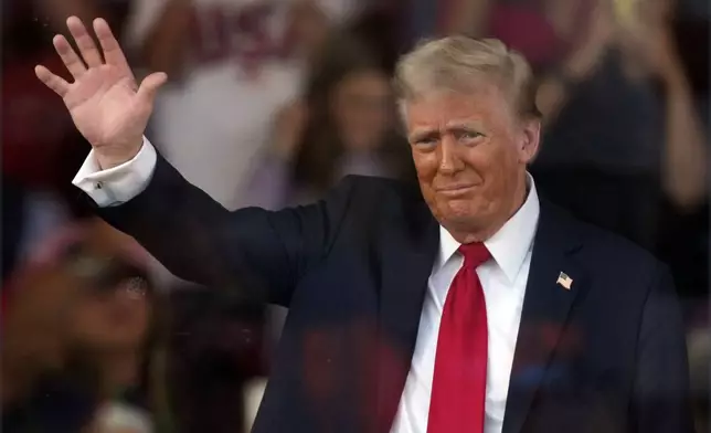 Republican presidential nominee former President Donald Trump waves at a campaign rally in Gastonia, N.C., Saturday, Nov. 2, 2024. (AP Photo/Chris Carlson)