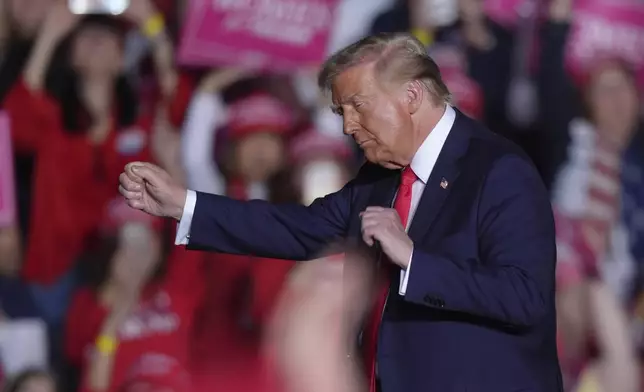 Republican presidential candidate former President Donald Trump dances at a campaign rally, Monday, Nov. 4, 2024, in Reading, Pa. (AP Photo/Chris Szagola)