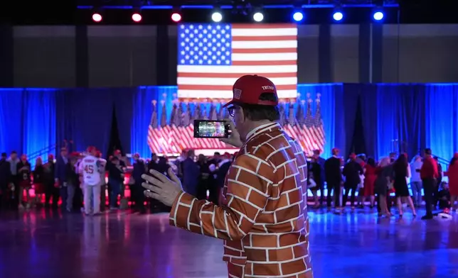 A supporter arrives at an election night watch party for Republican presidential nominee former President Donald Trump Tuesday, Nov. 5, 2024, in West Palm Beach, Fla. (AP Photo/Julia Demaree Nikhinson)