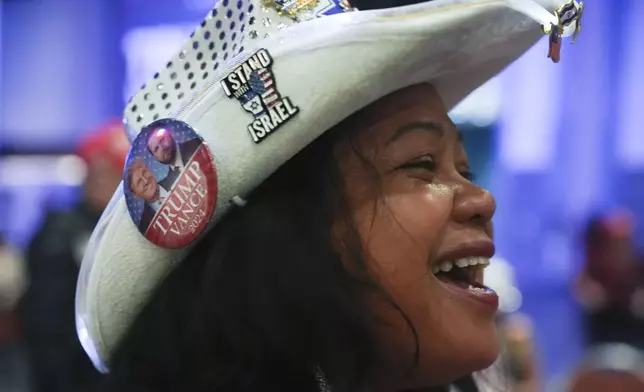 Mimi Israelah of Los Angeles, arrives to attend a watch party for Republican Presidential nominee former President Donald Trump at the Palm Beach County Convention Center during an election night watch party, Tuesday, Nov. 5, 2024, in West Palm Beach, Fla. (AP Photo/Lynne Sladky)