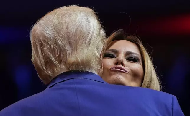 Republican presidential nominee former President Donald Trump greets former first lady Melania Trump during a campaign rally at Madison Square Garden, Sunday, Oct. 27, 2024, in New York. (AP Photo/Julia Demaree Nikhinson)