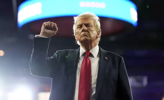 Republican presidential nominee former President Donald Trump gestures at a campaign rally at the Santander Arena, Wednesday, Oct. 9, 2024, in Reading, Pa. (AP Photo/Alex Brandon)