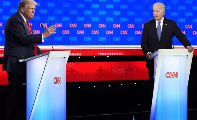 President Joe Biden, right, and Republican presidential candidate former President Donald Trump, left, participate in a presidential debate hosted by CNN, Thursday, June 27, 2024, in Atlanta. (AP Photo/Gerald Herbert)