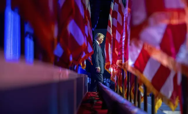 Republican presidential nominee former President Donald Trump arrives at an election night watch party at the Palm Beach Convention Center, Wednesday, Nov. 6, 2024, in West Palm Beach, Fla. (AP Photo/Julia Demaree Nikhinson)