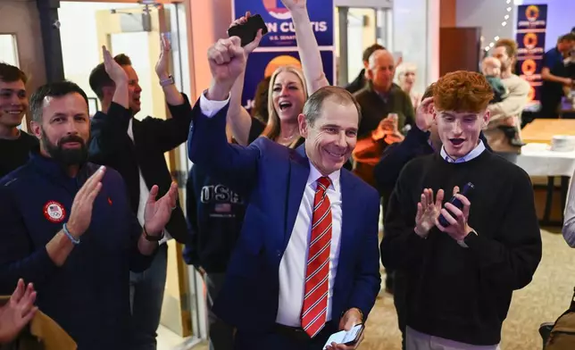 U.S. Rep. John Curtis greets supporters during a election night party Tuesday, Nov. 5, 2024, in Provo, Utah. (AP Photo/Alex Goodlett)