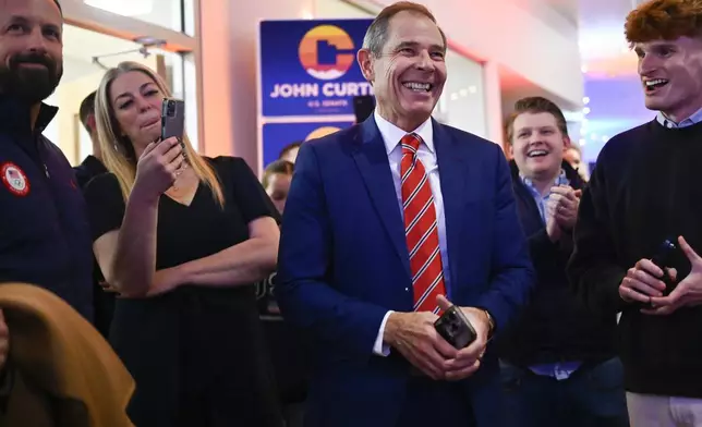 U.S. Rep. John Curtis greets supporters, Tuesday, Nov. 5, 2024, in Provo, Utah. (AP Photo/Alex Goodlett)