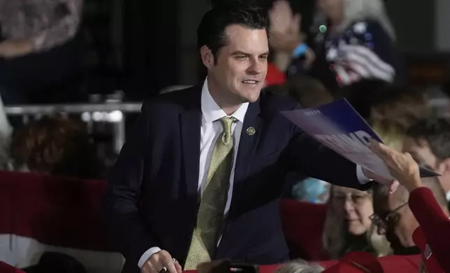 Rep. Matt Gaetz, R-Fla., signs autographs at a campaign event for Republican vice presidential nominee Sen. JD Vance, R-Ohio, Monday, Nov. 4, 2024, in Atlanta. (AP Photo/John Bazemore)