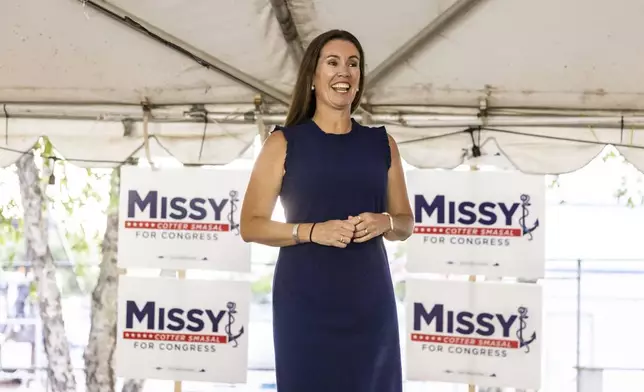 Missy Cotter Smasal addresses her supporters at Ballyhoos in Virginia Beach, Va., after winning the Democratic nomination in the race to represent the 2nd Congressional District in the U.S. House of Representatives, June 18, 2024. (Kendall Warner/The Virginian-Pilot via AP)