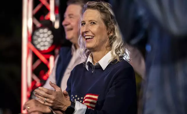 Republican incumbent Rep. Jen Kiggans, R-Va., running to represent Virginia's 2nd Congressional District in the U.S. House of Representatives, waits to go on stage and address supporters during a voting rally at Ballyhoos in Virginia Beach, Va., Monday, Nov. 4, 2024. (Kendall Warner/The Virginian-Pilot via AP)