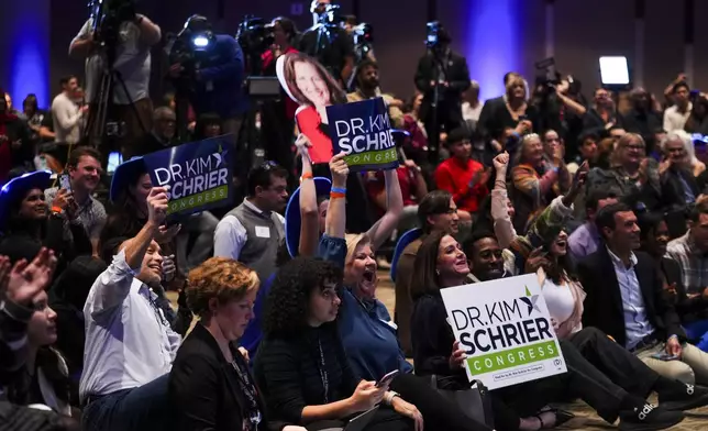 Supporters of Democratic Rep. Kim Schrier, representing Washington's 8th Congressional District, cheer as she speaks during the Washington State Democrats election night party on Election Day, Tuesday, Nov. 5, 2024, in Seattle. (AP Photo/Lindsey Wasson)