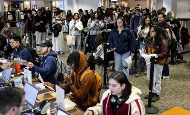 Voters cast ballots in Denver on Election Day, Tuesday, Nov. 5, 2024. (AP Photo/Chet Stgrange)