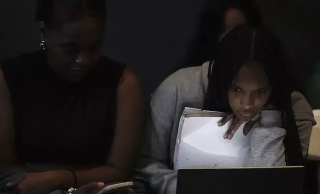 Students watch election coverage at Spelman College, Tuesday, Nov. 5, 2024, in Atlanta. (AP Photo/Brynn Anderson)