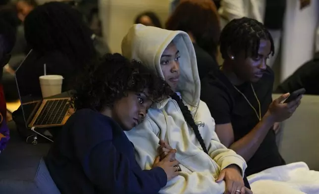 Leah Charles, left, and Tianna Adams, North Carolina A&amp;T students, gathers with other students for an election night watch party, Tuesday, Nov. 5, 2024, in Greensboro, N.C. (AP Photo/George Walker IV)