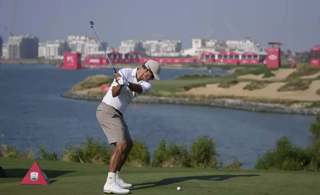 Adam Scott of Australia tees off at 12th hole during the second round of Abu Dhabi Golf Championship in Abu Dhabi, United Arab Emirates, Friday, Nov. 8, 2024. (AP Photo/Altaf Qadri)