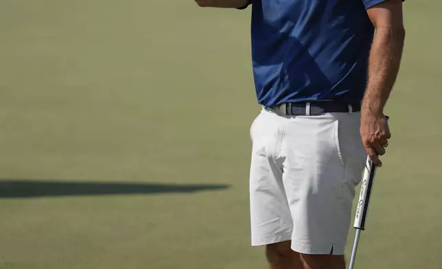 Paul Waring of England prepares to take a shot on 7th green in the final round of Abu Dhabi Golf Championship in Abu Dhabi, United Arab Emirates, Sunday, Nov. 10, 2024. (AP Photo/Altaf Qadri)