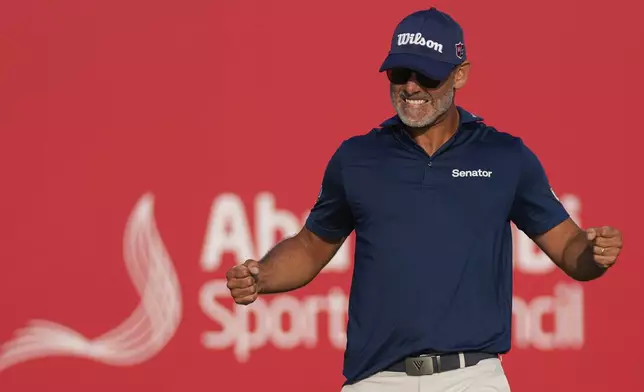 Paul Waring of England celebrates after winning the Abu Dhabi Golf Championship in Abu Dhabi, United Arab Emirates, Sunday, Nov. 10, 2024. (AP Photo/Altaf Qadri)