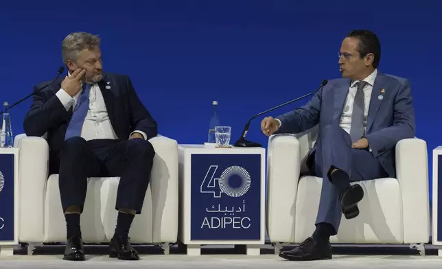 Murray Auchincloss CEO BP, left, watches as Wael Sawan CEO Shell, speaks during the Abu Dhabi International Petroleum Exhibition &amp; Conference (ADIPEC) in Abu Dhabi, United Arab Emirates, Monday, Nov. 4, 2024. (AP Photo/Altaf Qadri)