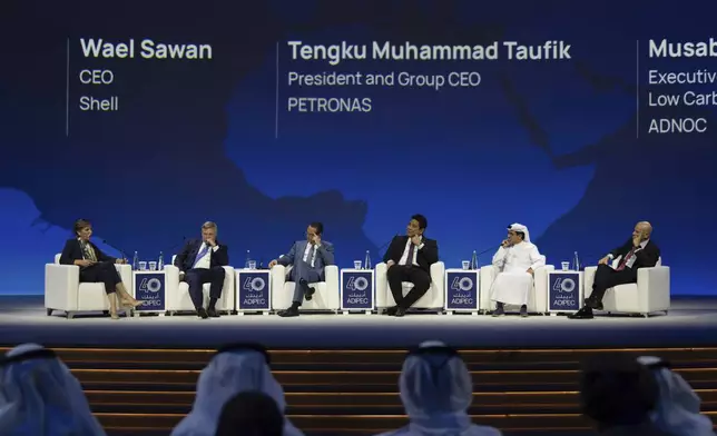 From left to right, Moderator Becky Anderson, Murray Auchincloss CEO BP, Wael Sawan CEO Shell, Tengku Muhammad Taufik President and CEO PETRONAS , Musabbeh Al Kaaba Executive Director ADNOC and Claudio Descalzi CEO Eni, participate in a panel during the Abu Dhabi International Petroleum Exhibition &amp; Conference (ADIPEC) in Abu Dhabi, United Arab Emirates, Monday, Nov. 4, 2024. (AP Photo/Altaf Qadri)