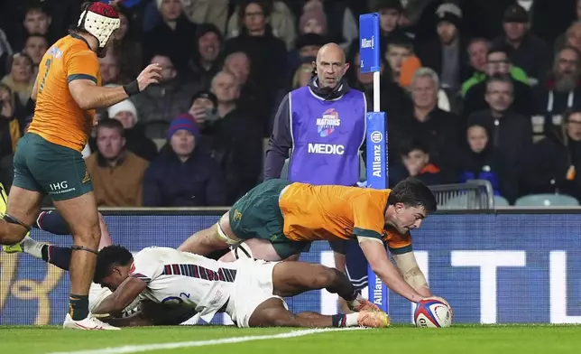 Australia's Jeremy Williams scores their side's second try during the Autumn Nations series rugby union match between England and Australia, at Twickenham stadium, London Saturday, Nov. 9, 2024. (David Davies/PA via AP)