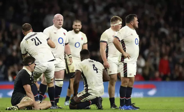 England's players show dejection, at the end of the Autumn Nations Series rugby match between England and New Zealand, at Twickenham stadium, in London Saturday, Nov. 2, 2024. (AP Photo/Ian Walton)