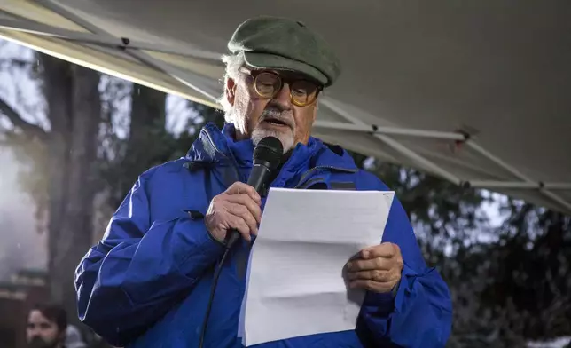 Wildlife photographer Thomas Mangelsen, who captured photos of grizzly bear No. 399, speaks about the life of No. 399 at a candlelight vigil in Jackson, Wyo., Saturday, Nov. 2, 2024. (AP Photo/Amber Baesler)