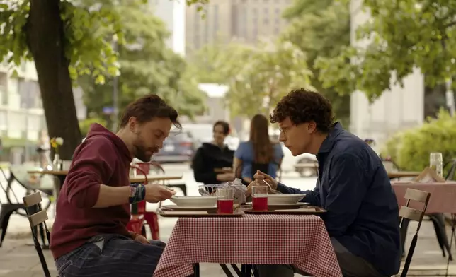 This image released by Searchlight Pictures shows Kieran Culkin, left, and Jesse Eisenberg in a scene from "A Real Pain." (Searchlight Pictures via AP)