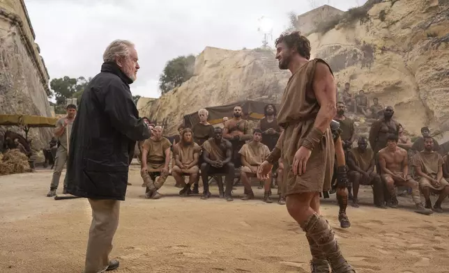 This image released by Paramount Pictures shows director Ridley Scott, left, and Paul Mescal on the set of "Gladiator II." (Aidan Monaghan/Paramount Pictures via AP)