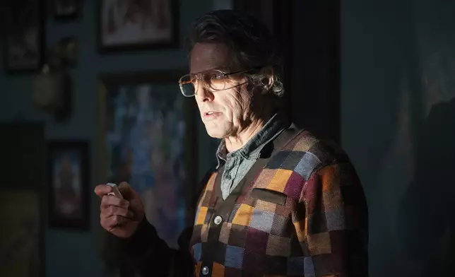 This image released by A24 shows Hugh Grant in a scene from "Heretic." (Kimberley French/A24 via AP)