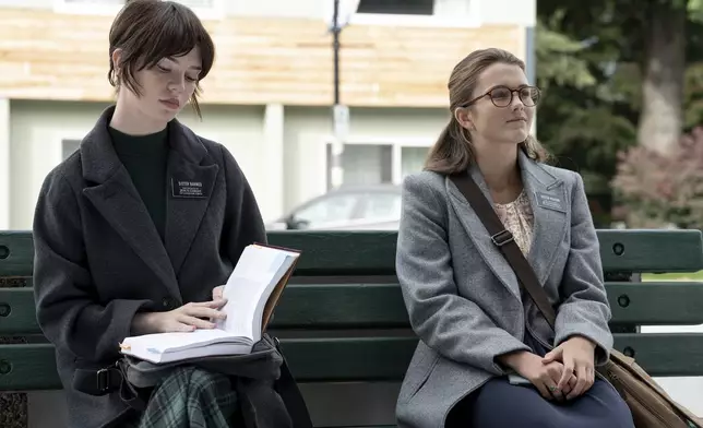 This image released by A24 shows Sophie Thatcher, left, and Chloe East in a scene from "Heretic." (Kimberley French/A24 via AP)