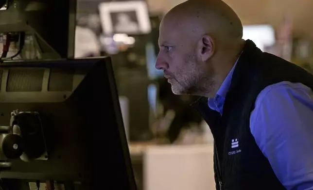 Specialist Meric Greenbaum work at his post on the floor of the New York Stock Exchange, Monday, Nov. 4, 2024. (AP Photo/Richard Drew)