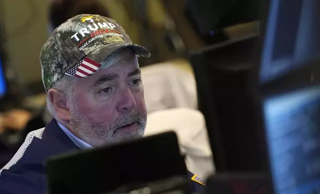 Trader Edward McCarthy works on the floor of the New York Stock Exchange, Wednesday, Nov. 6, 2024. (AP Photo/Richard Drew)