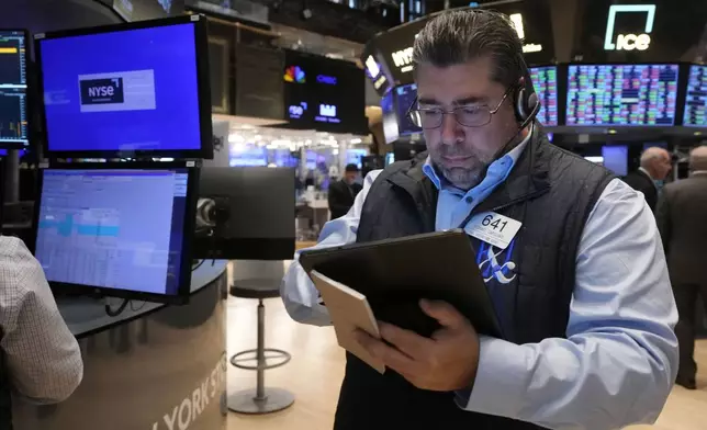 Trader Michael Capolino works on the floor of the New York Stock Exchange, Monday, Nov. 4, 2024. (AP Photo/Richard Drew)