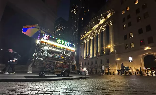 A food vendor's cart is parked across from the New York Stock Exchange on Wednesday, Oct. 30, 2024. (AP Photo/Peter Morgan)