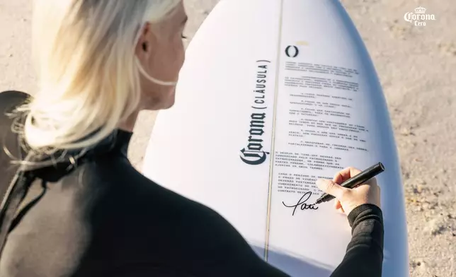Brazilian surfer Tatiana Weston Webb signs the Relaxation Clause (Photo: Business Wire)