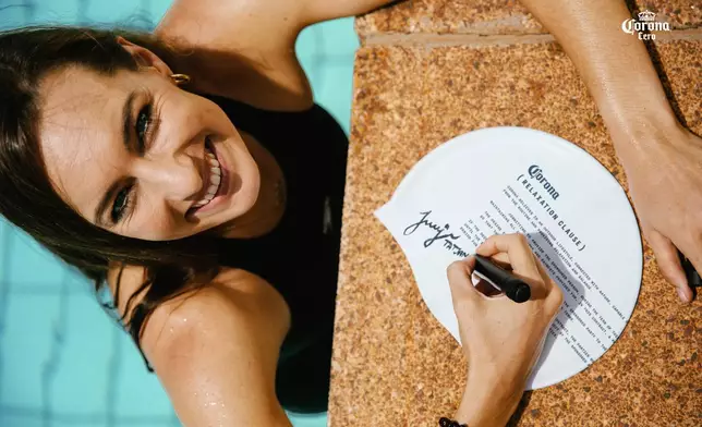 South African swimmer Tatjana Smith signs the Relaxation Clause (Photo: Business Wire)