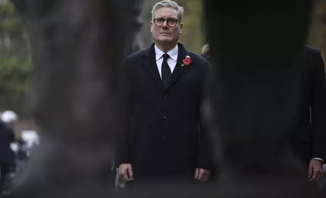 British Prime Minister Keir Starmer attends a ceremony in front of the statue of Winston Churchill near the Champs Elysees avenue, during commemorations marking the 106th anniversary of the WWI Armistice, in Paris, France, Monday, Nov.11 2024. (Christophe Petit Tesson, Pool via AP)