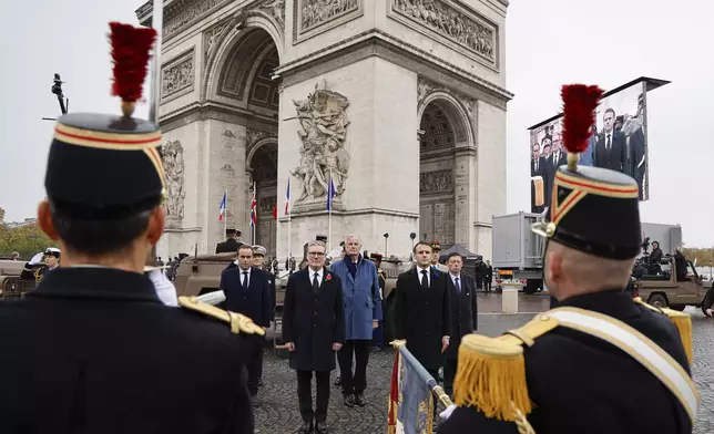 French Defense Minister Sebastien Lecornu, left,Britain's Prime Minister Keir Starmer, second left, France's Prime Minister Michel Barnier and France's President Emmanuel Macron review Republican Guards by the Arc de Triomphe during commemorations marking the 106th anniversary of the November 11, 1918, Armistice, ending World War I, at the Arc de Triomphe in Paris, Monday, Nov. 11, 2024. ( Ludovic Marin, Pool via AP)