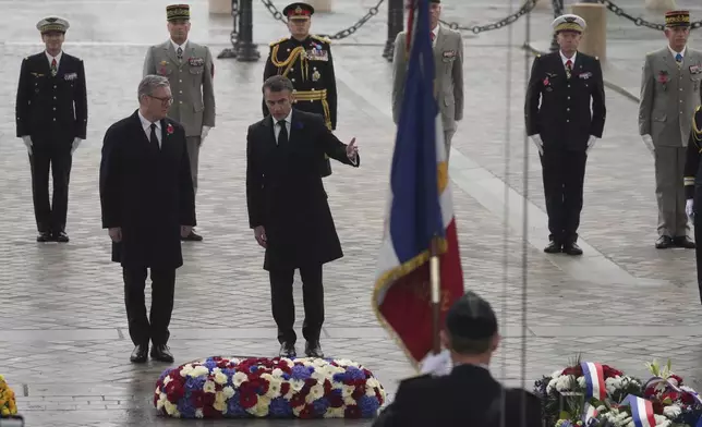 French President Emmanuel Macron and British Prime Minister Keir Starmer, left, attend ceremonies marking the 106th anniversary of the Armistice, a celebration of their countries' friendship, as nations across the world pay tribute to their fallen soldiers in World War I, Monday, Nov. 11, 2024 in Paris, (AP Photo/Michel Euler, Pool)