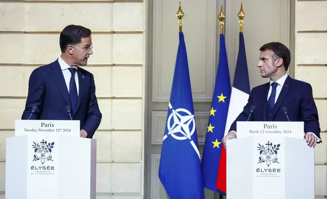 French President Emmanuel Macron and NATO Secretary General Mark Rutte deliver statements during their meeting at the Elysee Palace, in Paris, France, Tuesday, Nov. 12, 2024. (Manon Cruz/ Pool Photo via AP)