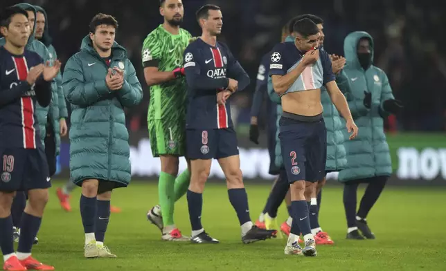 PSG's players are seen after the end of the Champions League opening phase soccer match between Paris Saint Germain and Atletico Madrid, at the Parc des Princes stadium, in Paris, Wednesday, Nov. 6, 2024. (AP Photo/Michel Euler)