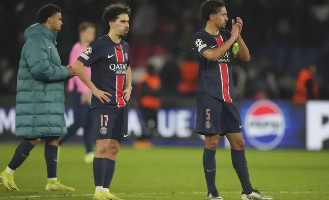 PSG's players are seen after the end of the Champions League opening phase soccer match between Paris Saint Germain and Atletico Madrid, at the Parc des Princes stadium, in Paris, Wednesday, Nov. 6, 2024. (AP Photo/Michel Euler)