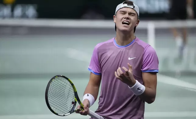 Denmark's Holger Rune reacts during the semifinal match of the Paris Masters tennis tournament against Germany's Alexander Zverev at the Accor Arena on Saturday, Nov. 2, 2024, in Paris. (AP Photo/Thibault Camus)