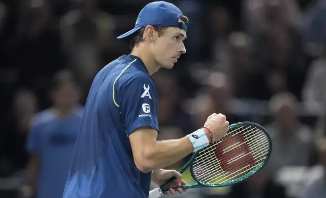 Alex de Minaur, of Australia, celebrates winning a point to Denmark's Holger Rune during their quarterfinal match of the Paris Masters tennis tournament at the Accor Arena, Friday, Nov. 1, 2024 in Paris. (AP Photo/Michel Euler)