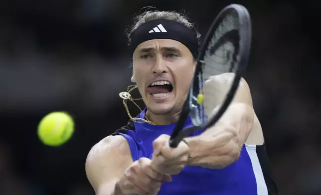 Germany's Alexander Zverev returns the ball to France's Arthur Fils during their third round match of the Paris Masters tennis tournament at the Accor Arena, Thursday, Oct. 31, 2024 in Paris. (AP Photo/Michel Euler)