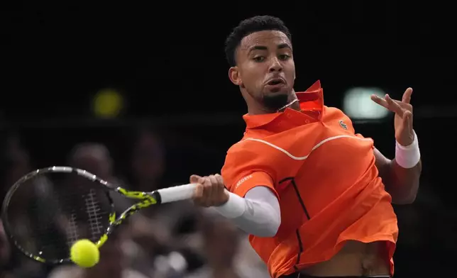 France's Arthur Fils returns the ball to Germany's Alexander Zverev during their third round match of the Paris Masters tennis tournament at the Accor Arena, Thursday, Oct. 31, 2024 in Paris. (AP Photo/Michel Euler)