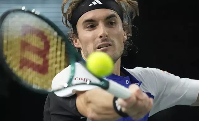 Greece's Stefanos Tsitsipas returns the ball to Germany's Alexander Zverev during their quarterfinal match of the Paris Masters tennis tournament at the Accor Arena, Friday, Nov. 1, 2024 in Paris. (AP Photo/Michel Euler)